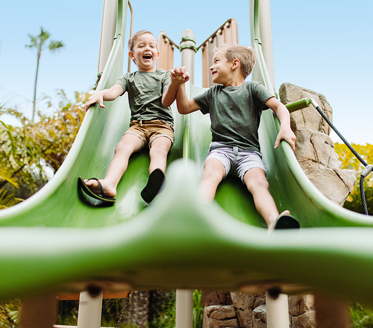 Kids playing on the playground, an amenity of the Bahia Beach and Boat Club members